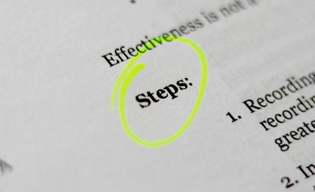 Text document with "Steps:" circled in yellow highlighter. Words "Effectiveness" and "Recording" visible. Focused, instructional mood.